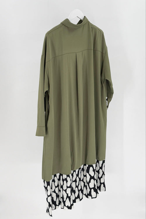 Green dress with leopard print hem on a white background