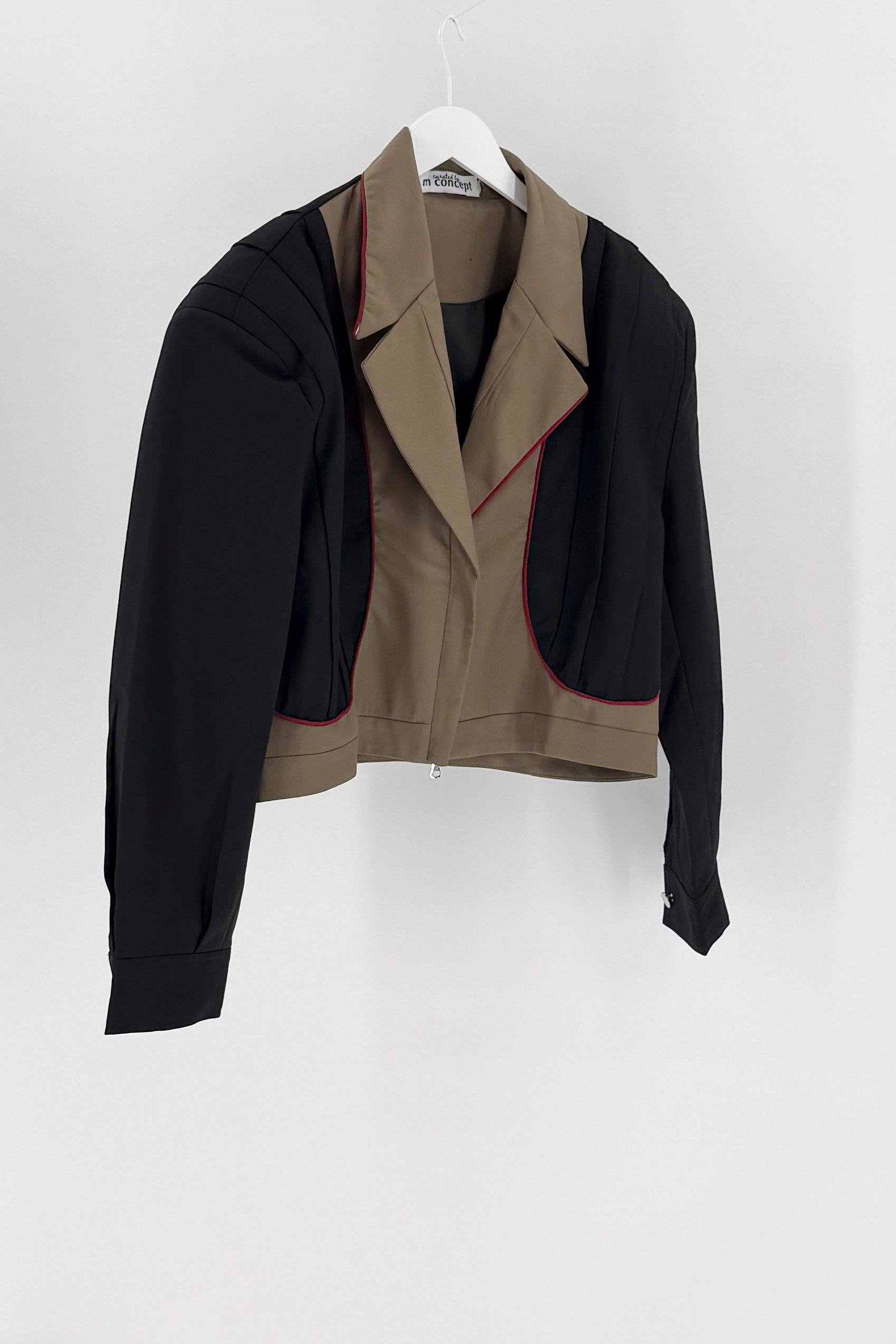Black jacket with beige interior on a white background