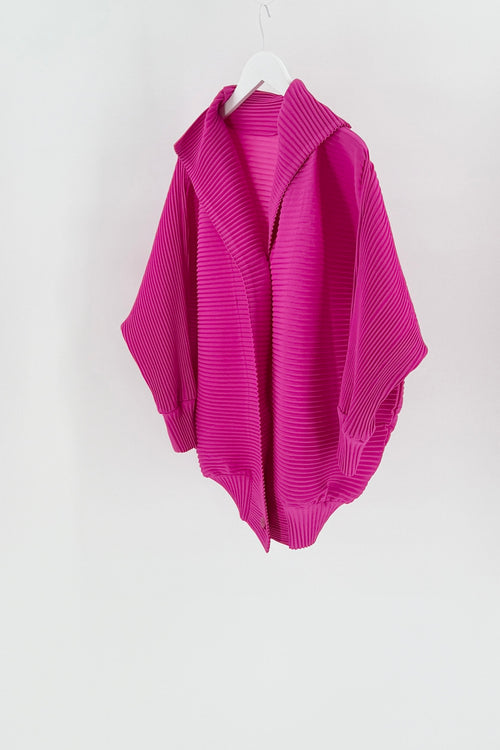 Pink ribbed sweater on a white hanger against a white background