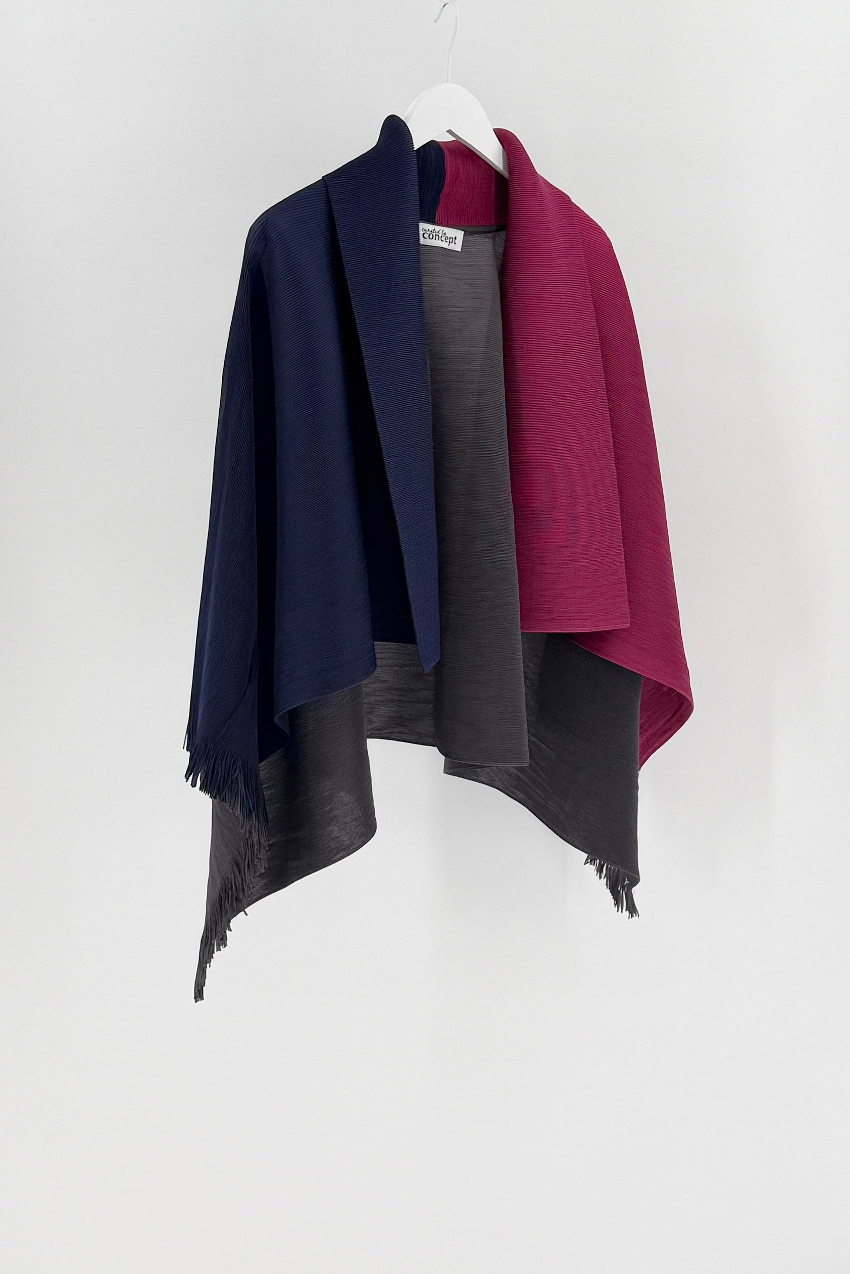 Cardigan open style in navy, gray, and burgundy draped over a white hanger against a white background.