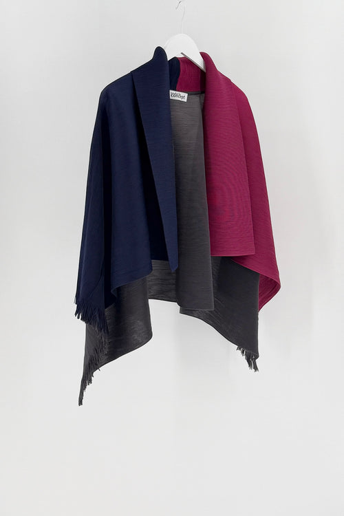 Cardigan open style in navy, gray, and burgundy draped over a white hanger against a white background.