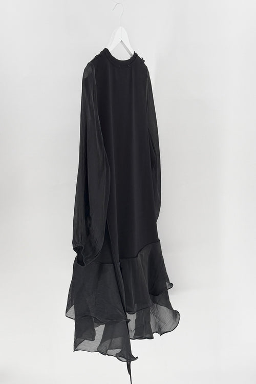Black long-sleeve dress on a white hanger against a white background