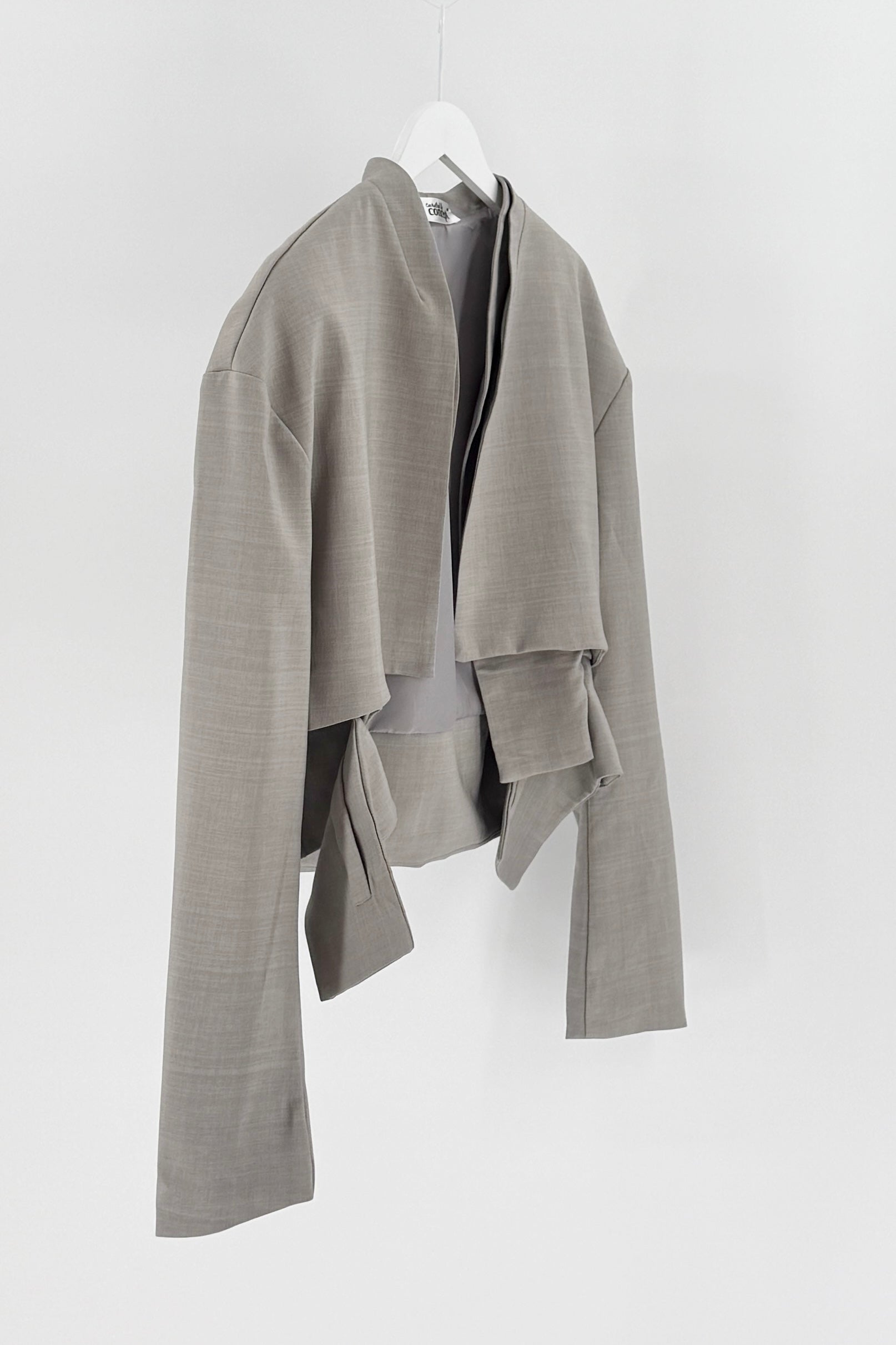 Gray textured jacket on a white hanger against a white background