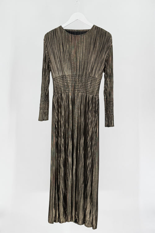 Long-sleeve dress with a pleated pattern on a white background