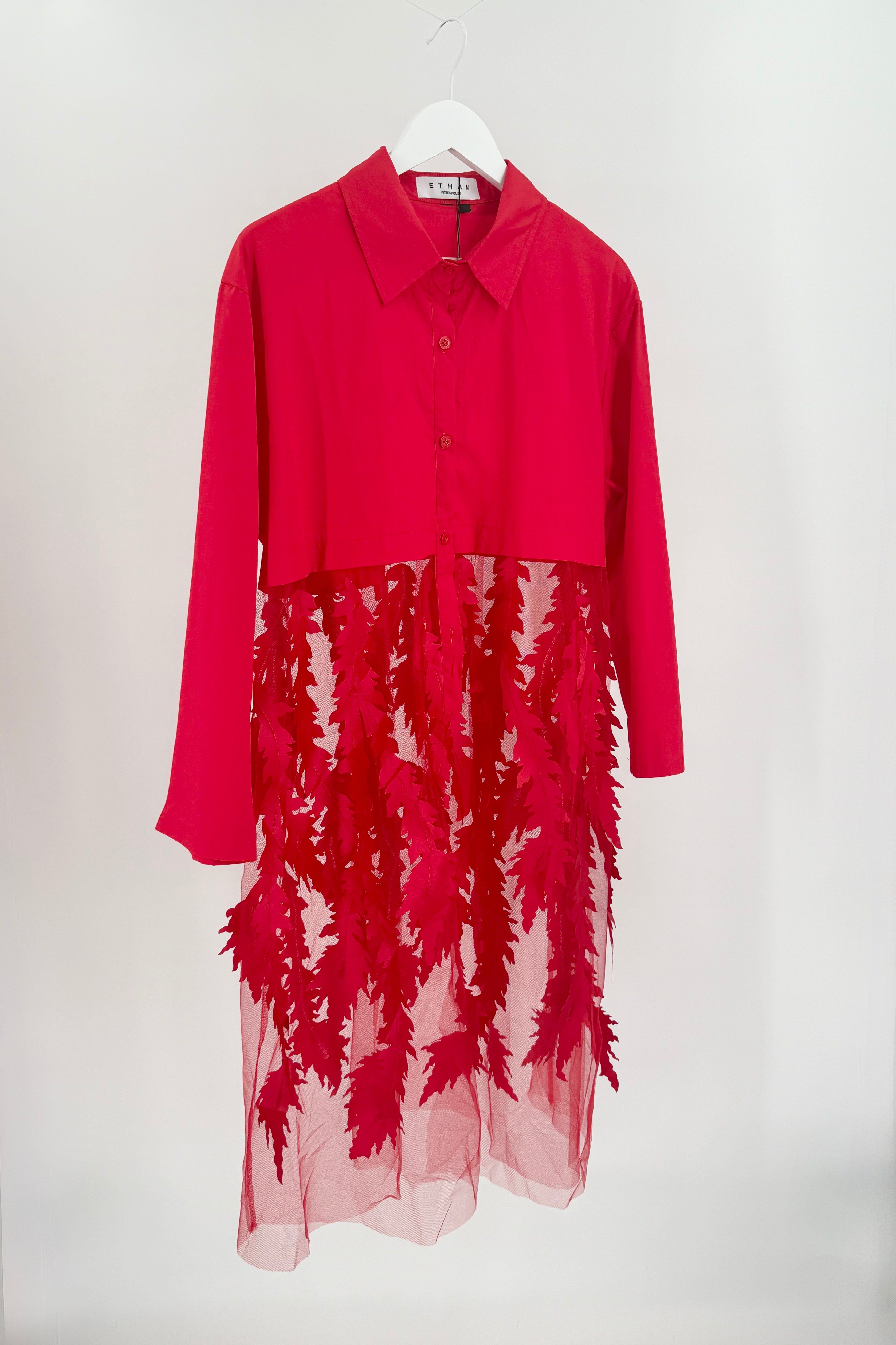 Red long overcoat with mesh bottom. Decorated with red leaves on the mesh.