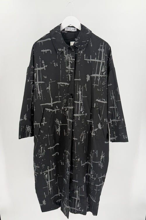 Lightweight black button up dress with a scattered grey horizontal and vertical paint stroke print. 